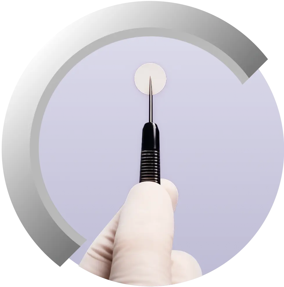 Gliadel Wafer being held with a surgical instrument.