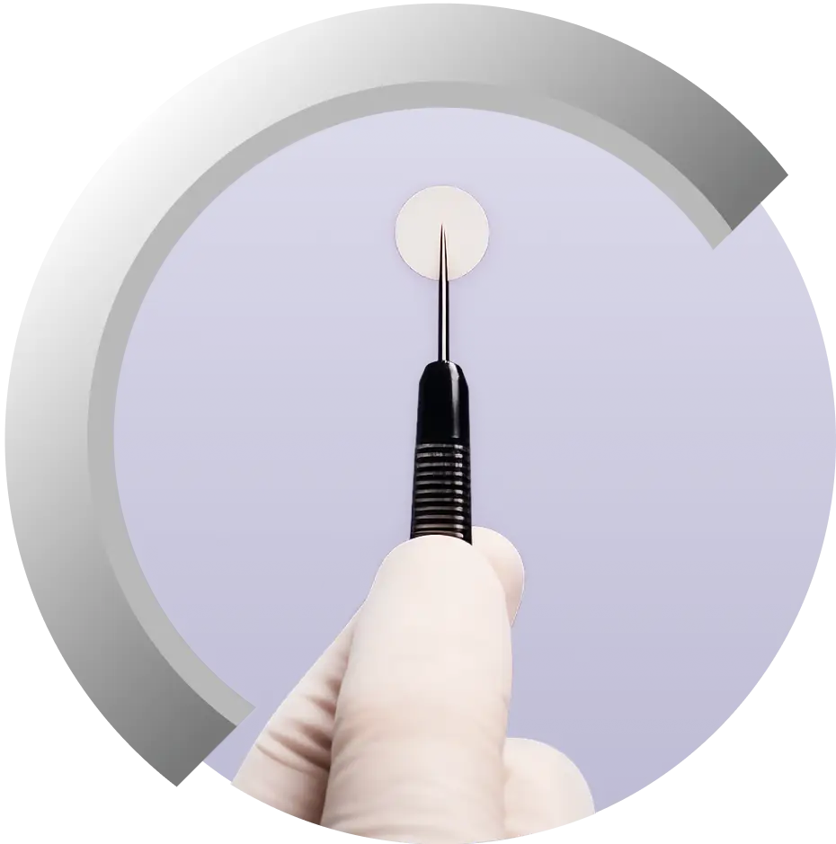 Gliadel Wafer being held with a surgical instrument.