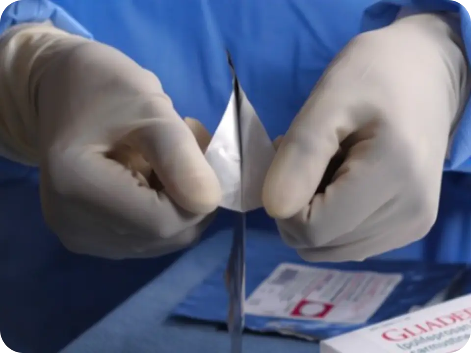 Healthcare professional opening a pouch.