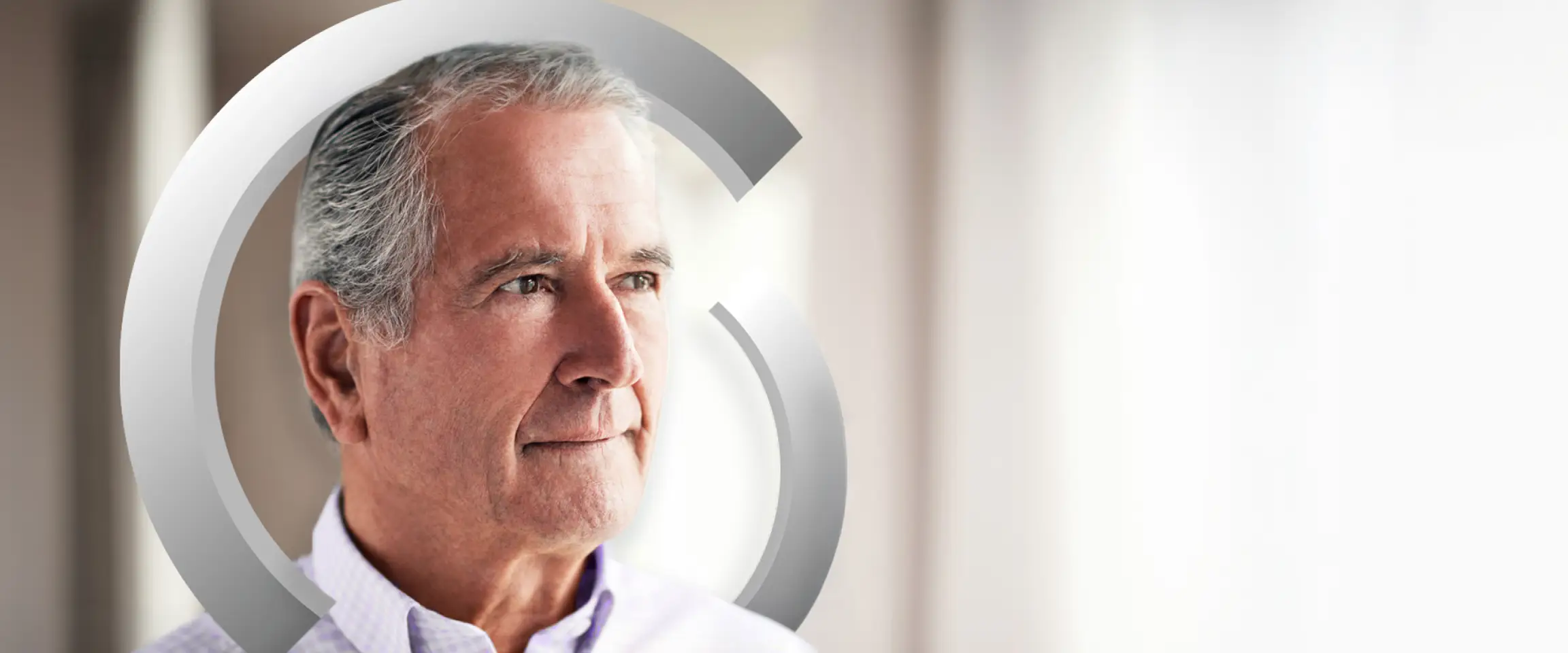 A man with gray hair, wearing a light-colored formal shirt, looking off to the distance. Actor portrayal