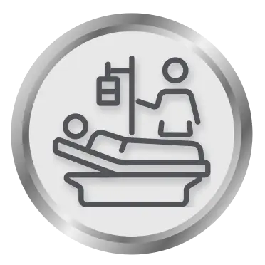 Icon: Patient in a hospital bed, with a healthcare professional checking on them