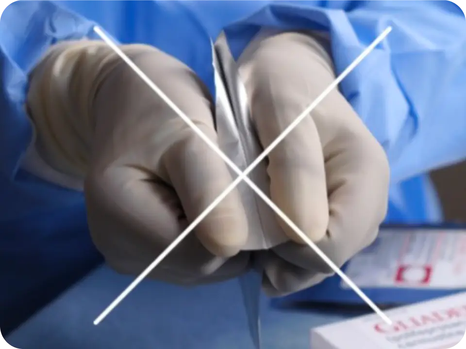 Healthcare professional opening a pouch. Image is struck through indicating incorrect method to open pouch.