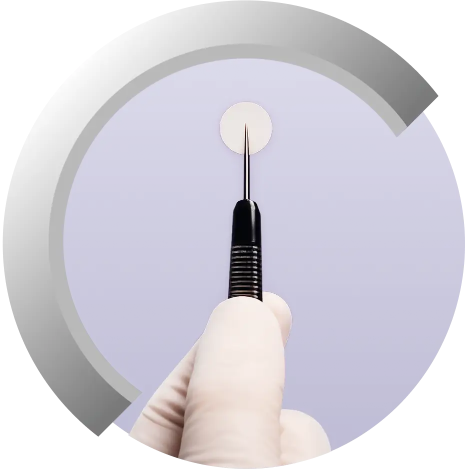 Gliadel Wafer being held with a surgical instrument.